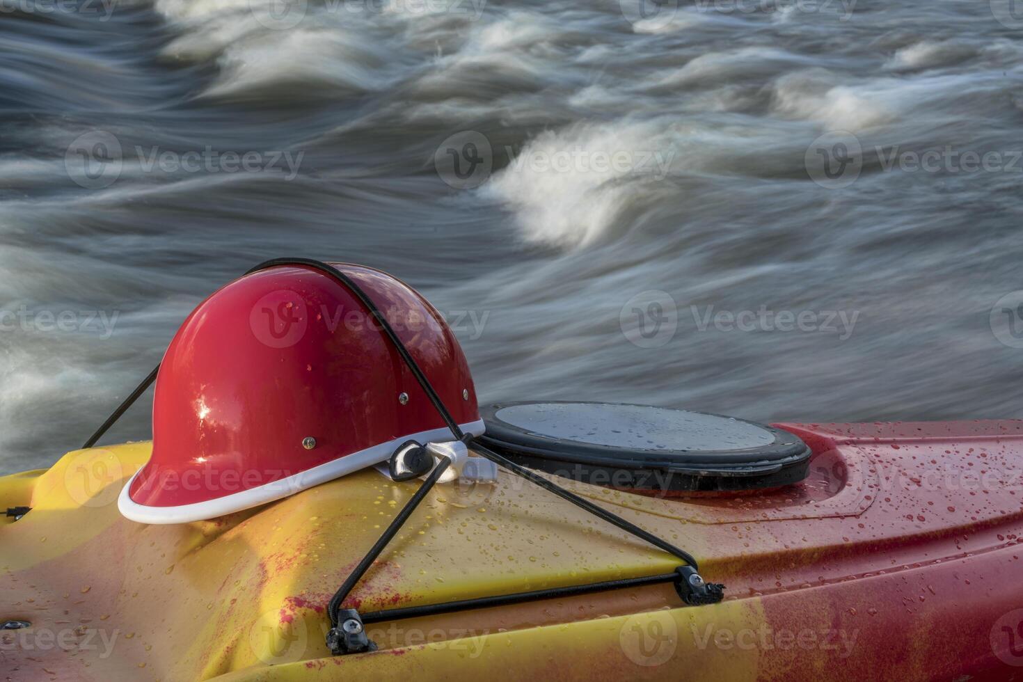 kayaking helmet on kayak deck photo