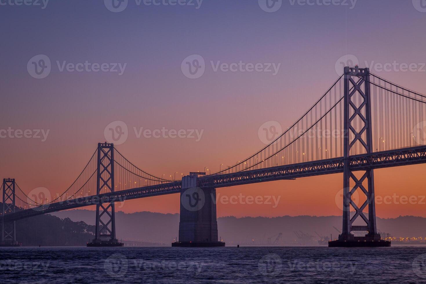 silhouette of suspension bridge photo