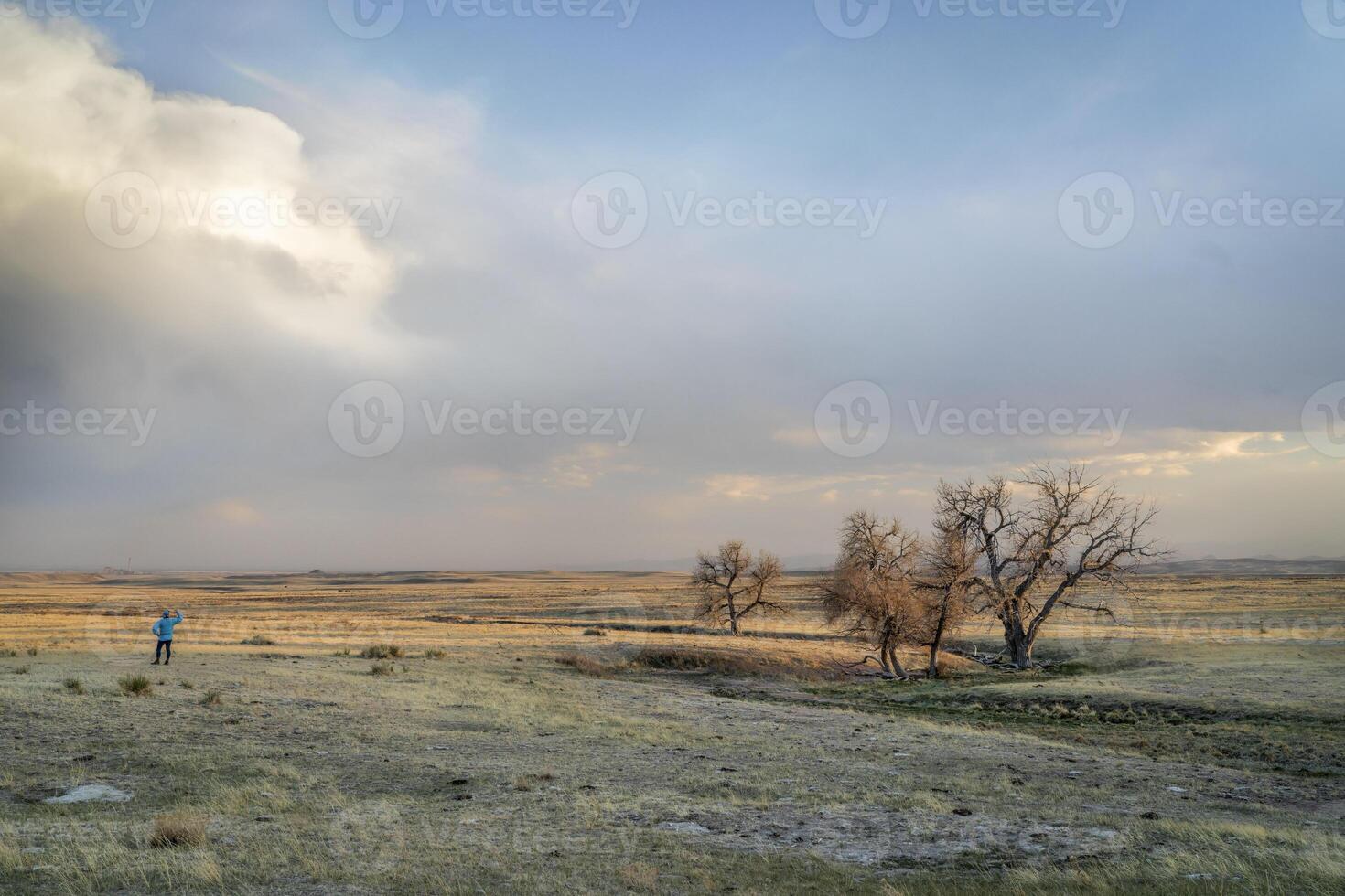 prairie in northern Colorado with a lonely male figure photo