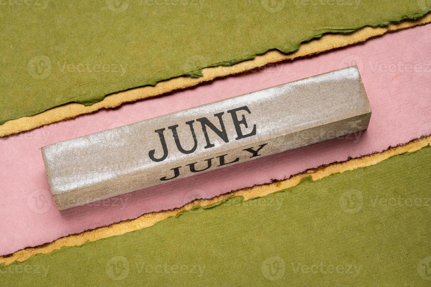 June text on grunge wooden block photo