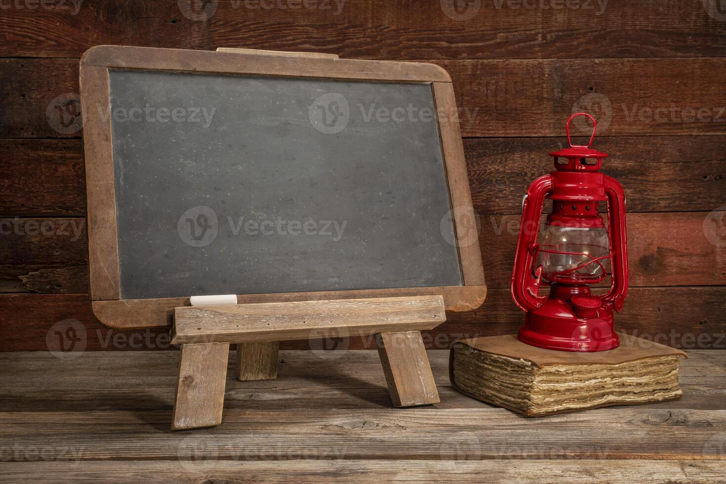 blank blackboard sign on rustic wood photo