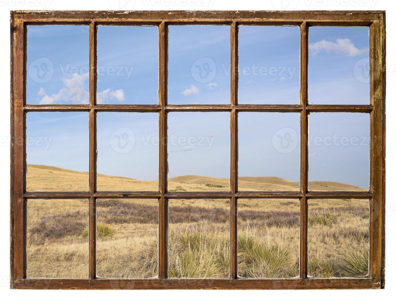 clouds over prairie window view photo