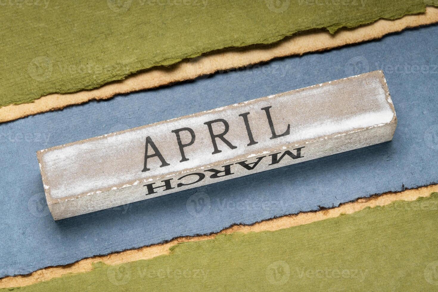 April text on grunge wooden block photo