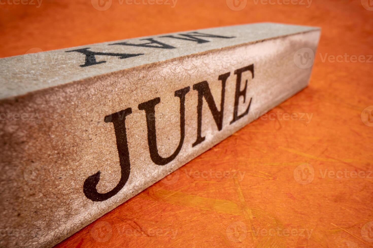 June text on grunge wooden block photo