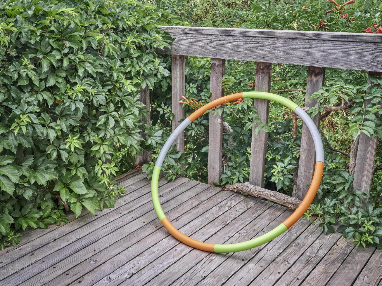 weighted hula hoop on a backyard deck photo