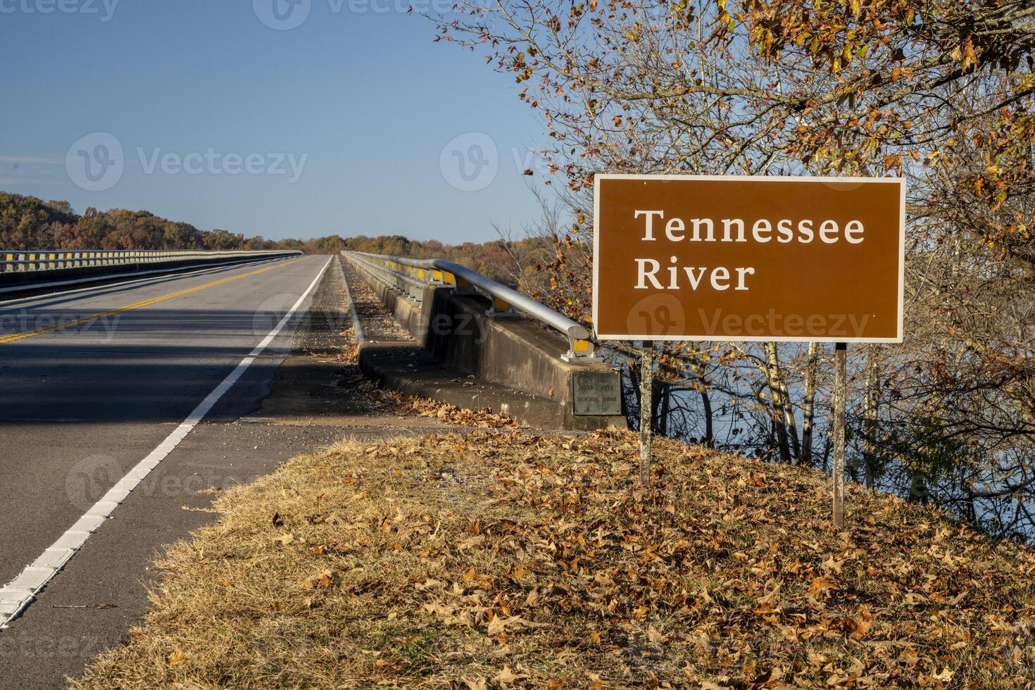 Tennessee River road sign at Natchez Trace Parkway - crossing from Tennessee to Alabama in fall scenery photo