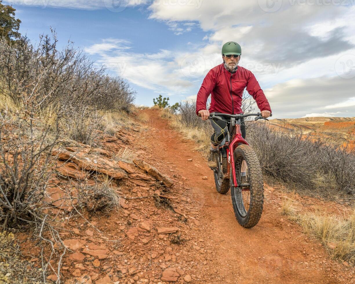 riding a fat mountain bike at Colorado foothills photo