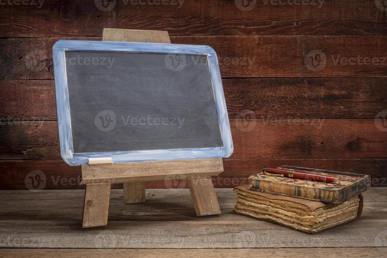 blank blackboard sign on rustic wood photo