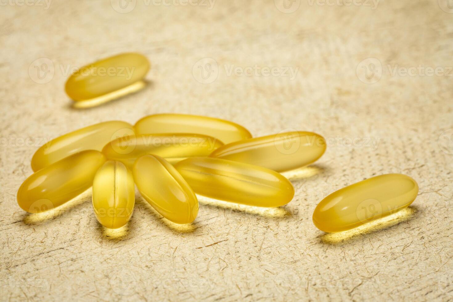 cod liver oil - dietary supplement, a pile of capsules, healthy eating concept photo