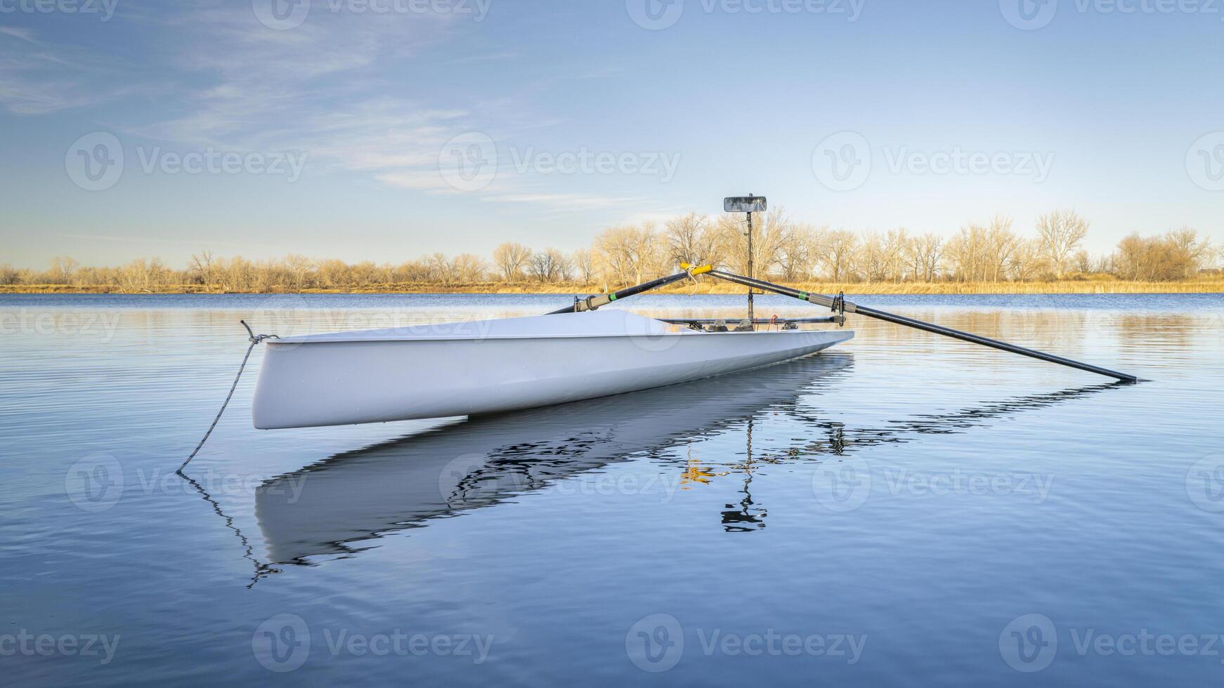 Coastal rowing shell by on a lake in northern Colorado in winter or early spring scenery. photo