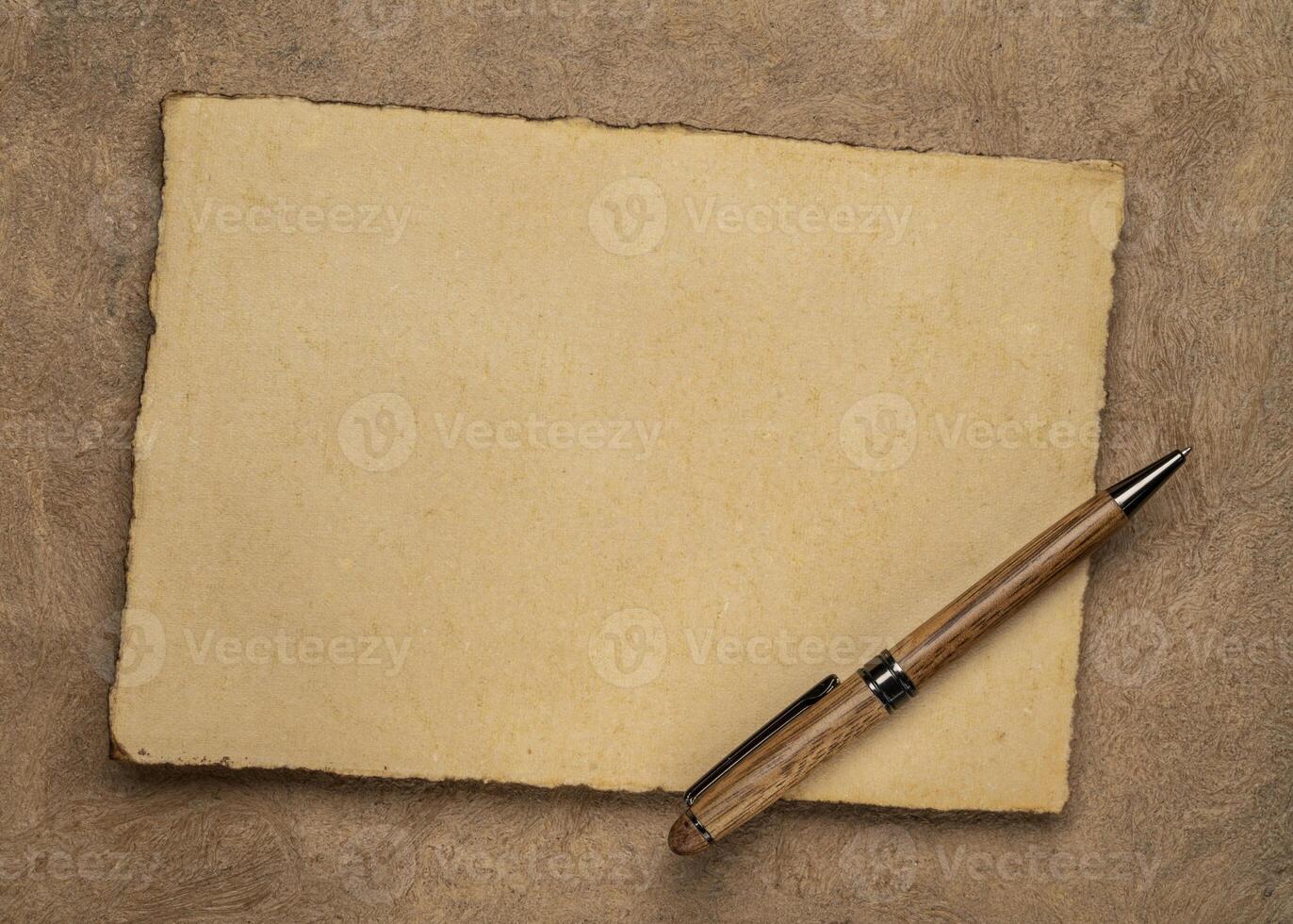 sheets of blank handmade paper with rough edges photo