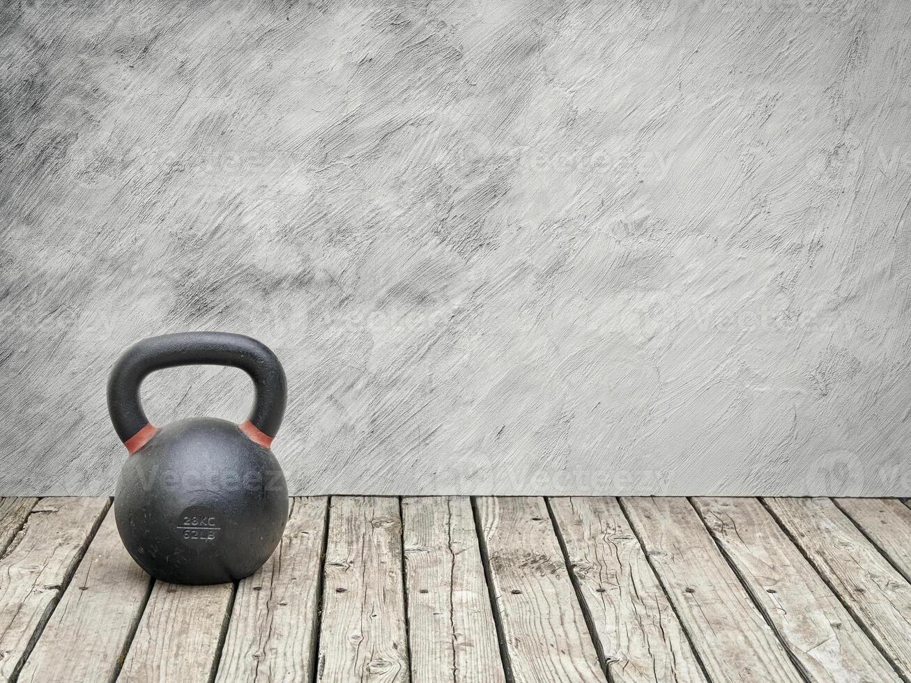 iron kettlebell on a rustic wood photo