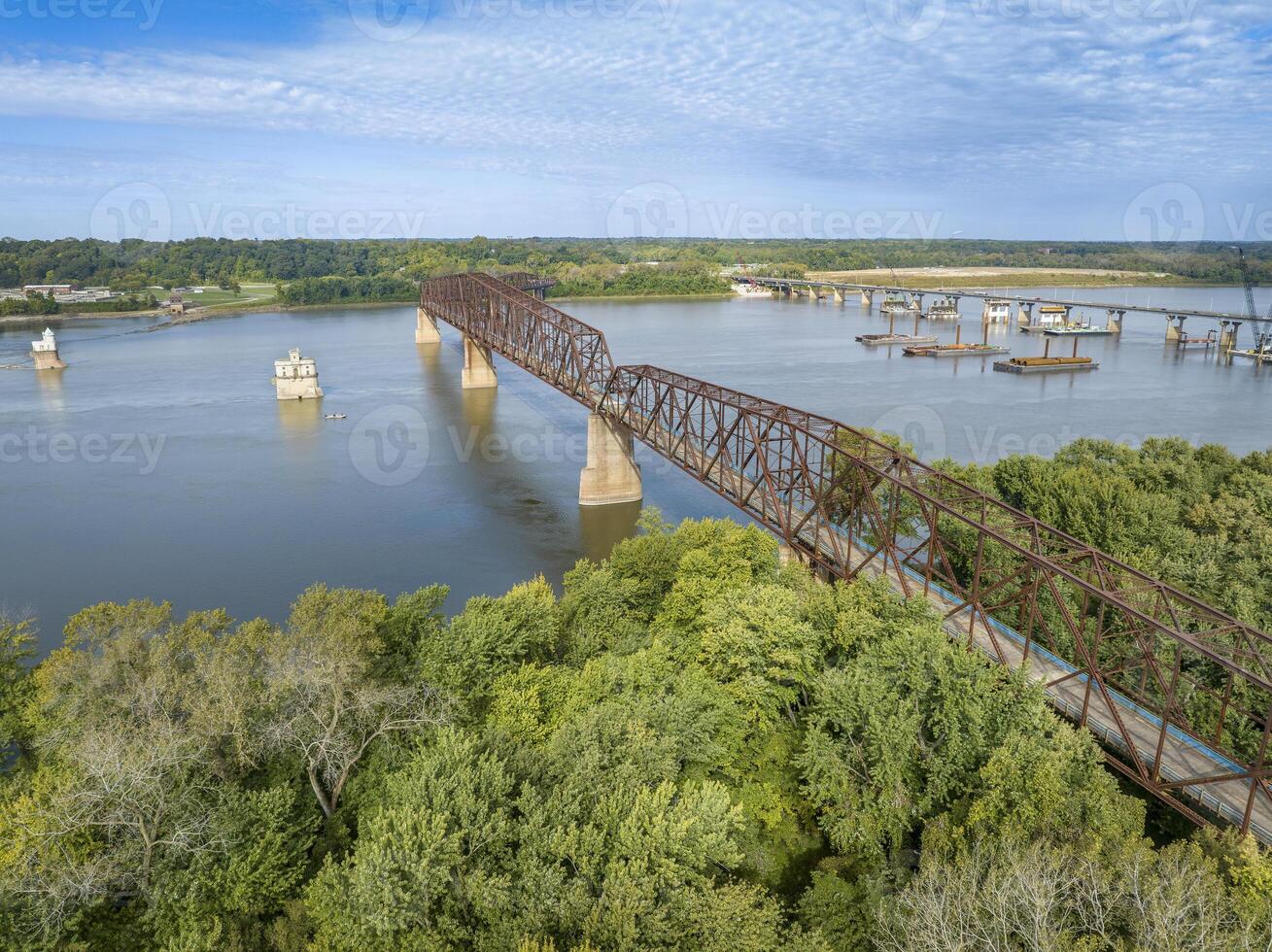 Chain of Rocks on the Mississippi RIver above St Louis with water towers, old historic bridge and the new bridge with construction work photo