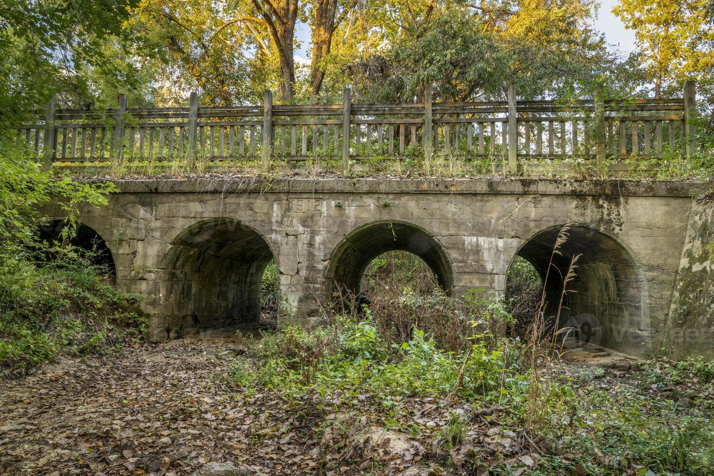 concrete arch bridge on Katy Trail near Dutzow, Missouri, in fall scenery photo