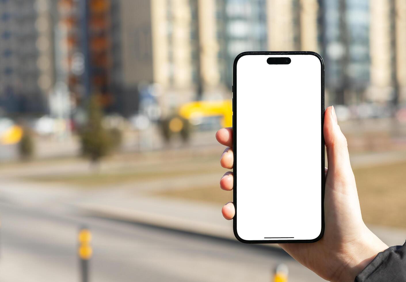 Berlin Germany January 21 2024 Hand holding mobile phone, iphone screen mockup, blank smartphone photo