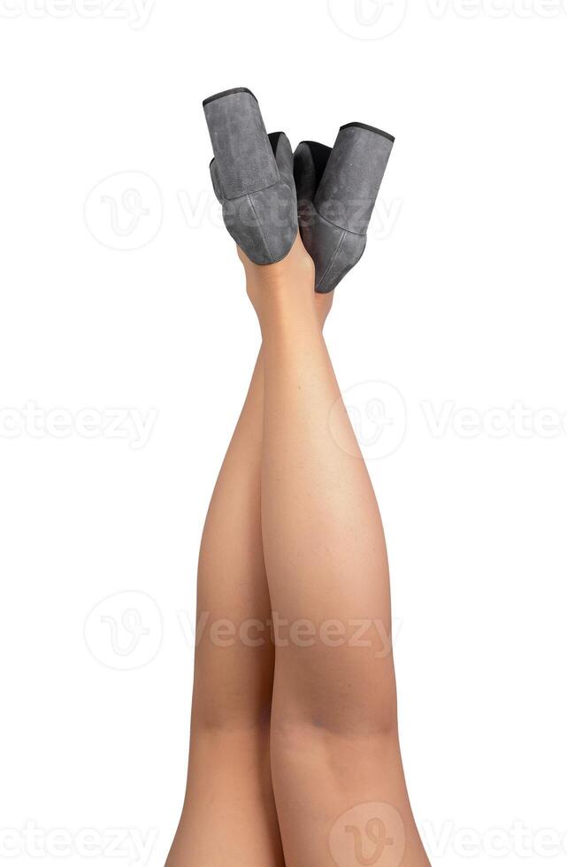 Female legs up, crossed pose, position, wearing gray heeled shoes isolated on white, back view photo