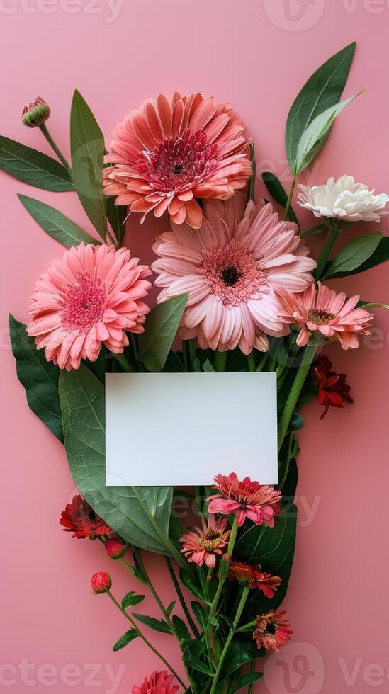 Bouquet of beautiful flowers with blank card on pink background photo