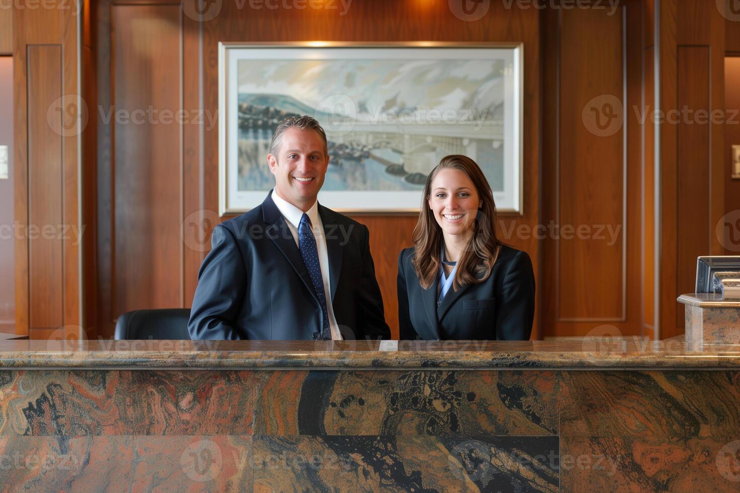 Portrait of two receptionist in uniform at desk in luxury hotel lobby. Occupation concept. photo