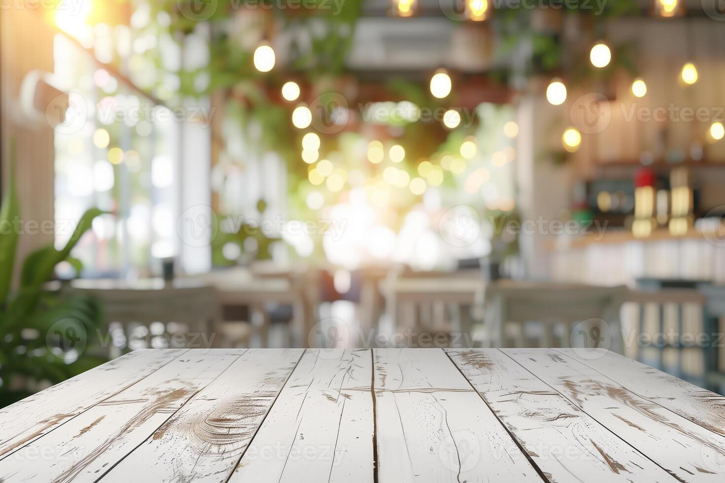 Top of white wooden table with blurred bokeh light and soft natural light in coffee shop. Copy space photo