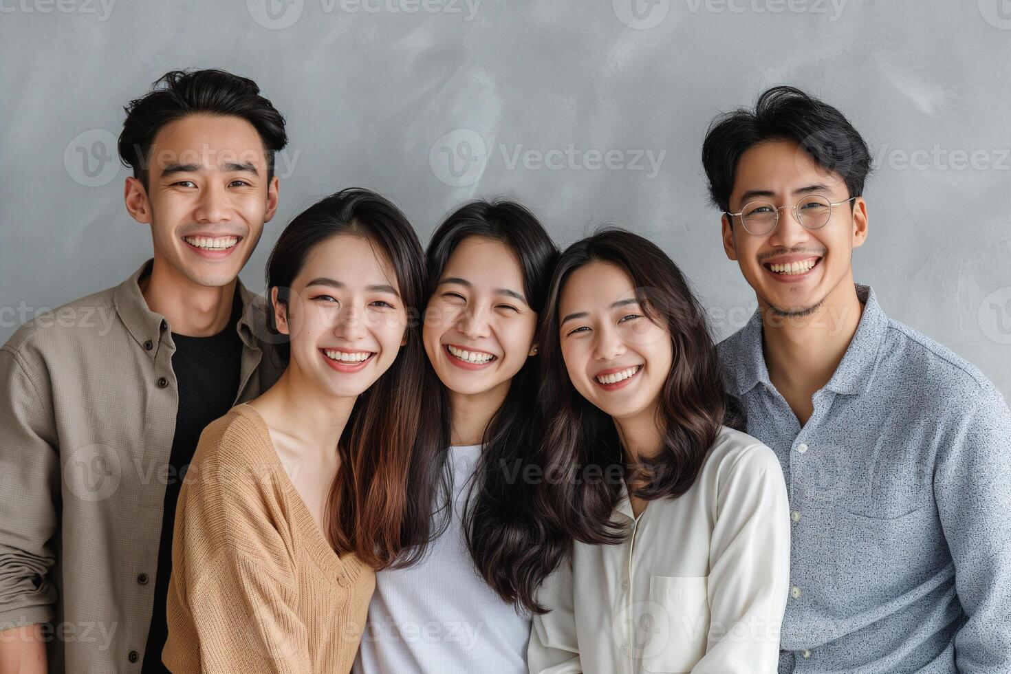 Group of happy Asian friends have a great time. Friendship and lifestyle concept. Studio shot photo