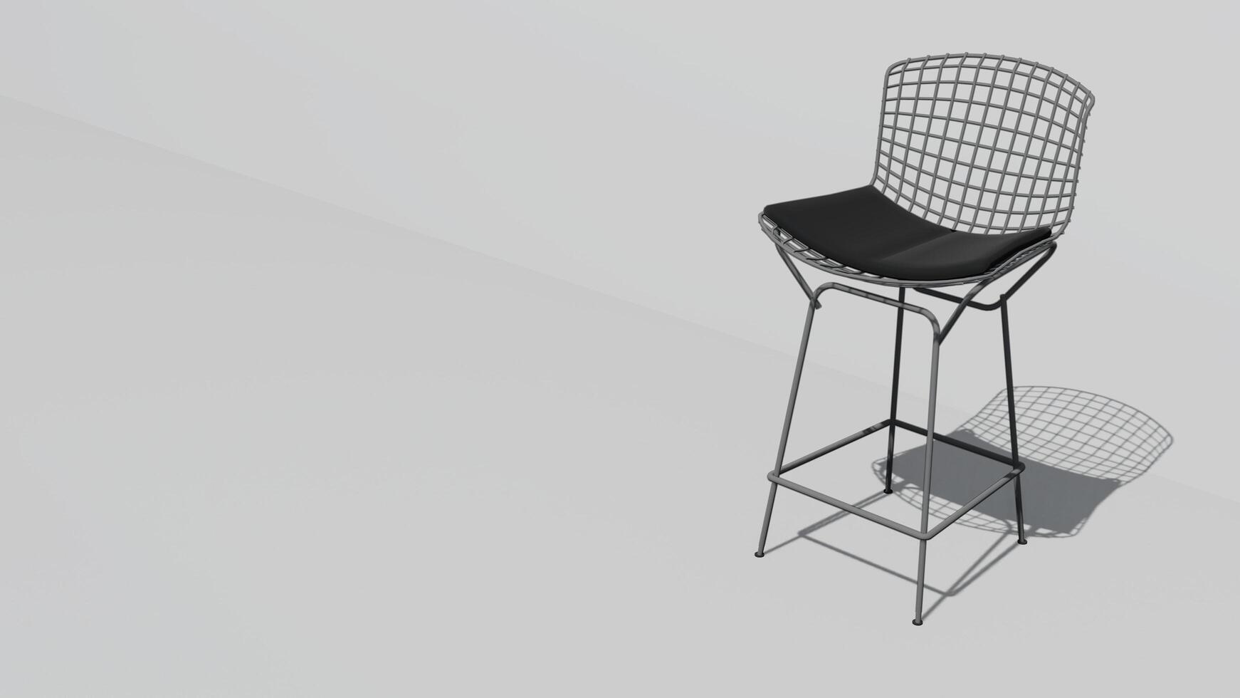 A white chair with a black cushion sits on a white wall photo