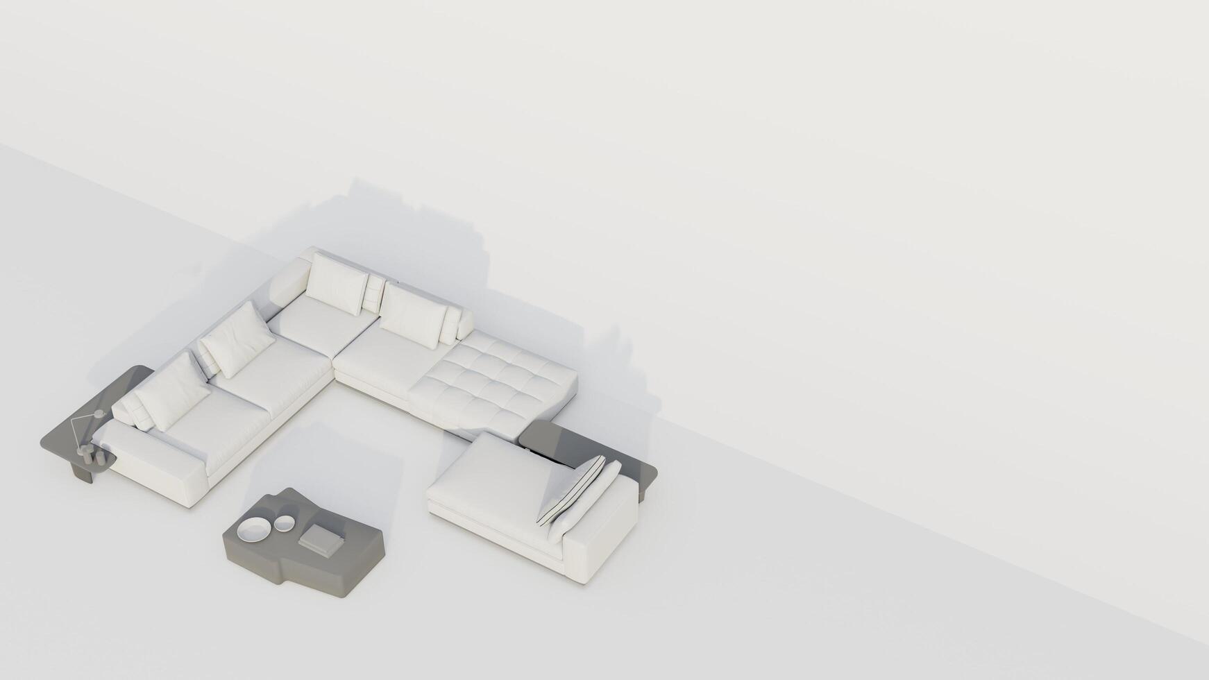 A white couch is placed in front of a white wall photo