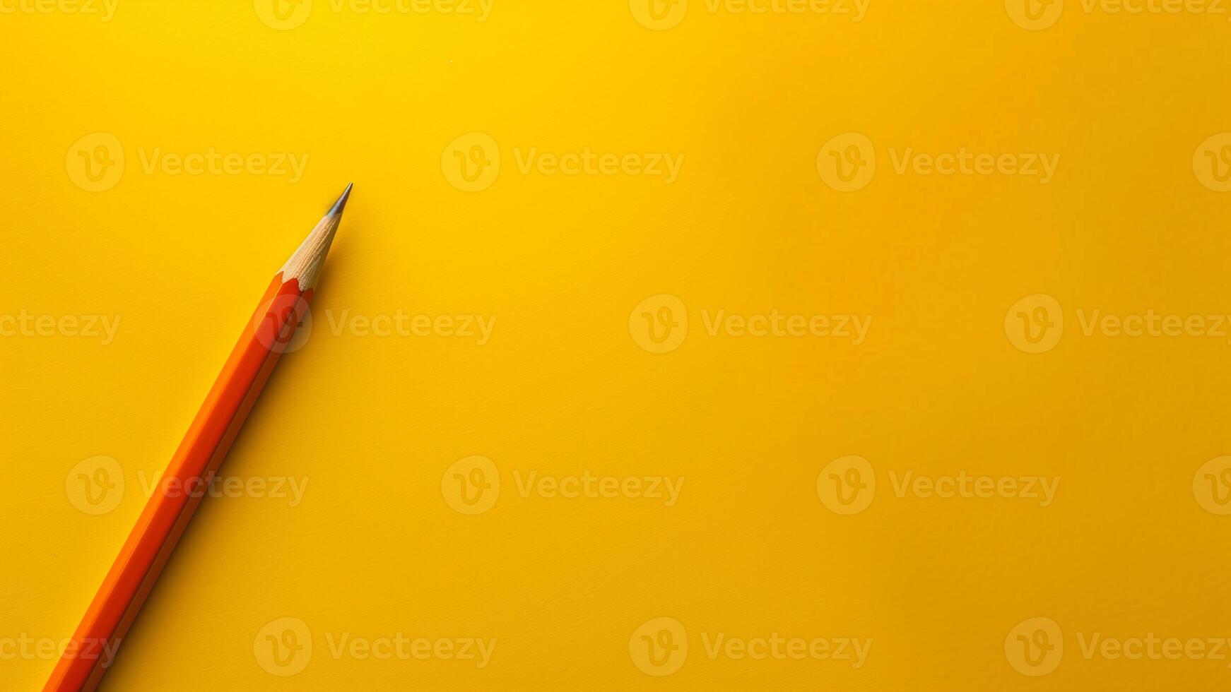 Top view of pencil on yellow background with copy space. photo