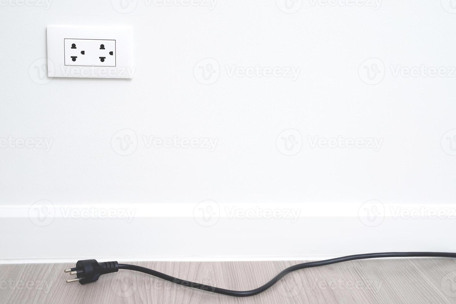 Close Up the electrical power socket and plug socket on wall. photo