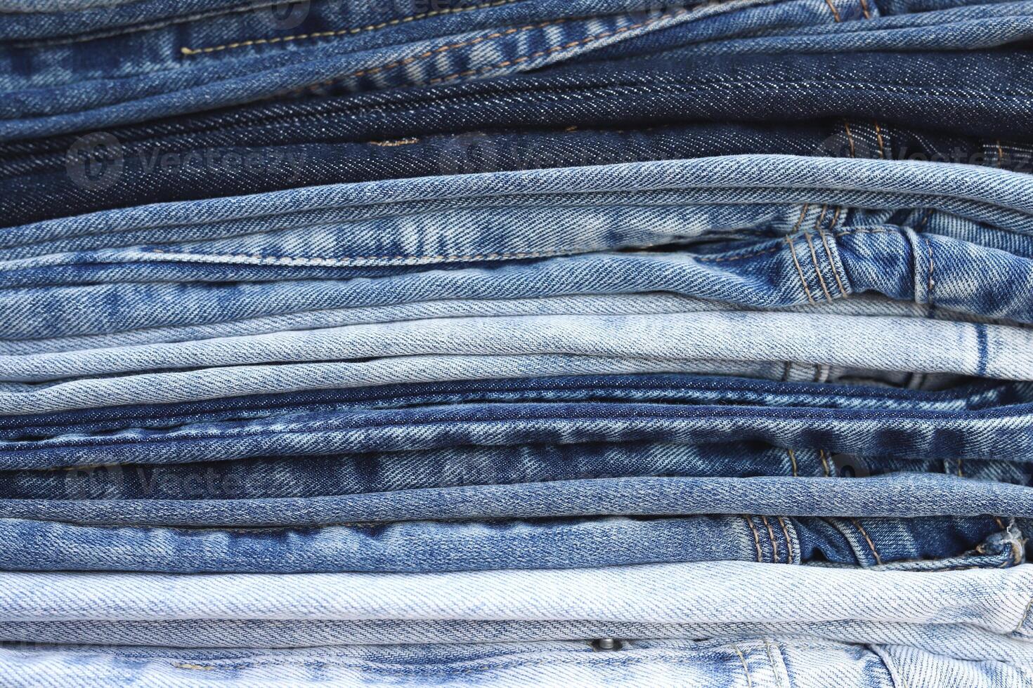 beautiful fashion jeans Stacked in layers at the jeans store photo