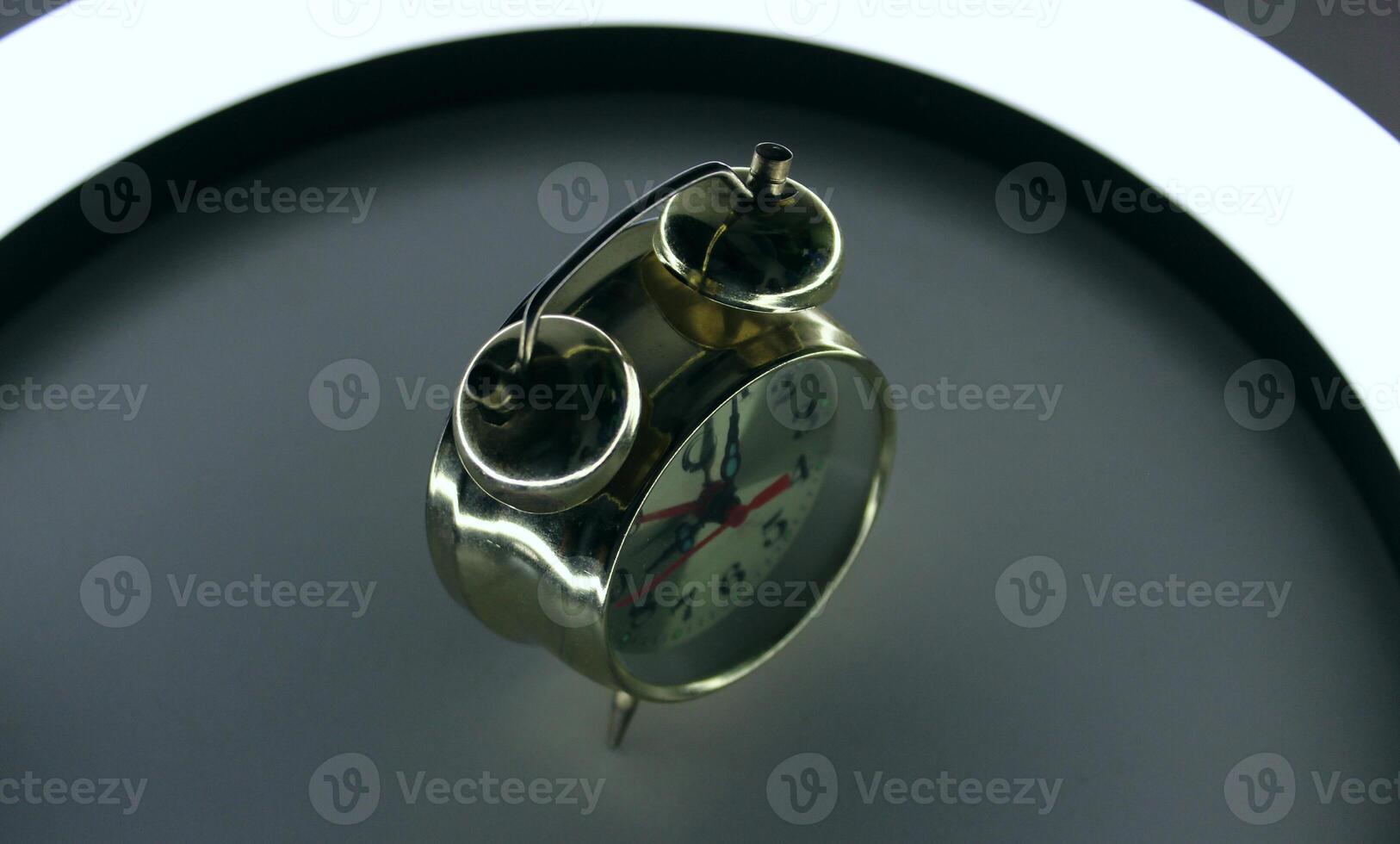 Vintage Alarm Clock On A Bedside With Soft Illumination At Early Morning photo