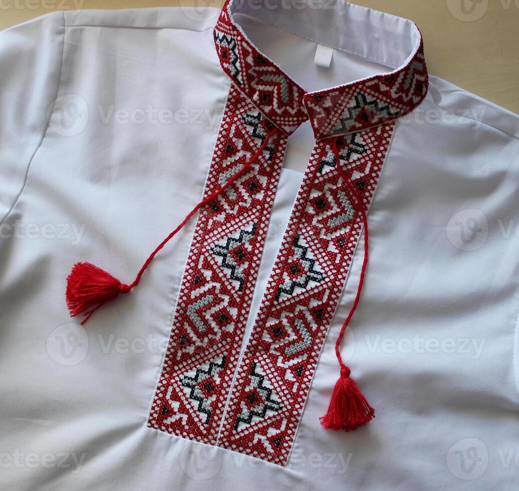 Ukrainian handcraft vyshyvanka shirt embroidered with red and black threads. Ukrainian national clothing photo