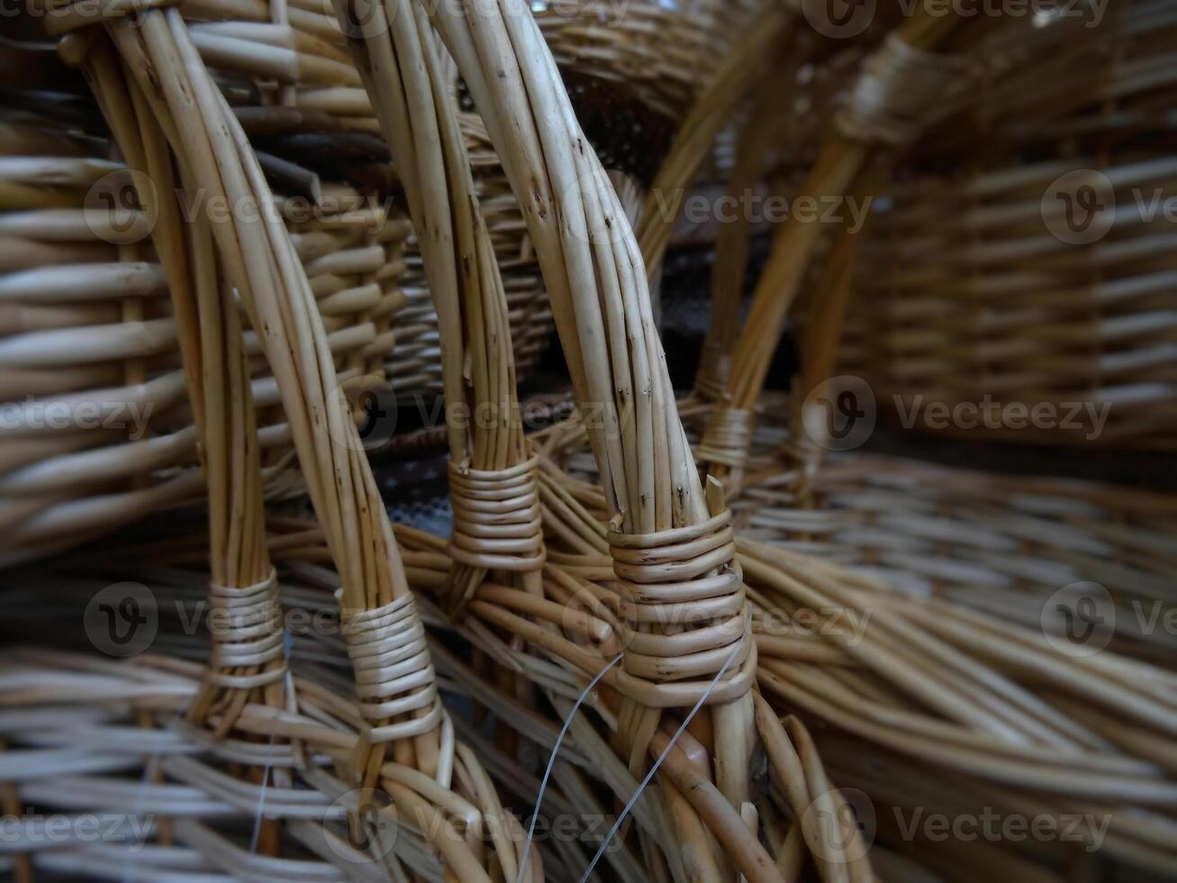 Wicker craft. Woven reed baskets with handles closeup stock photo