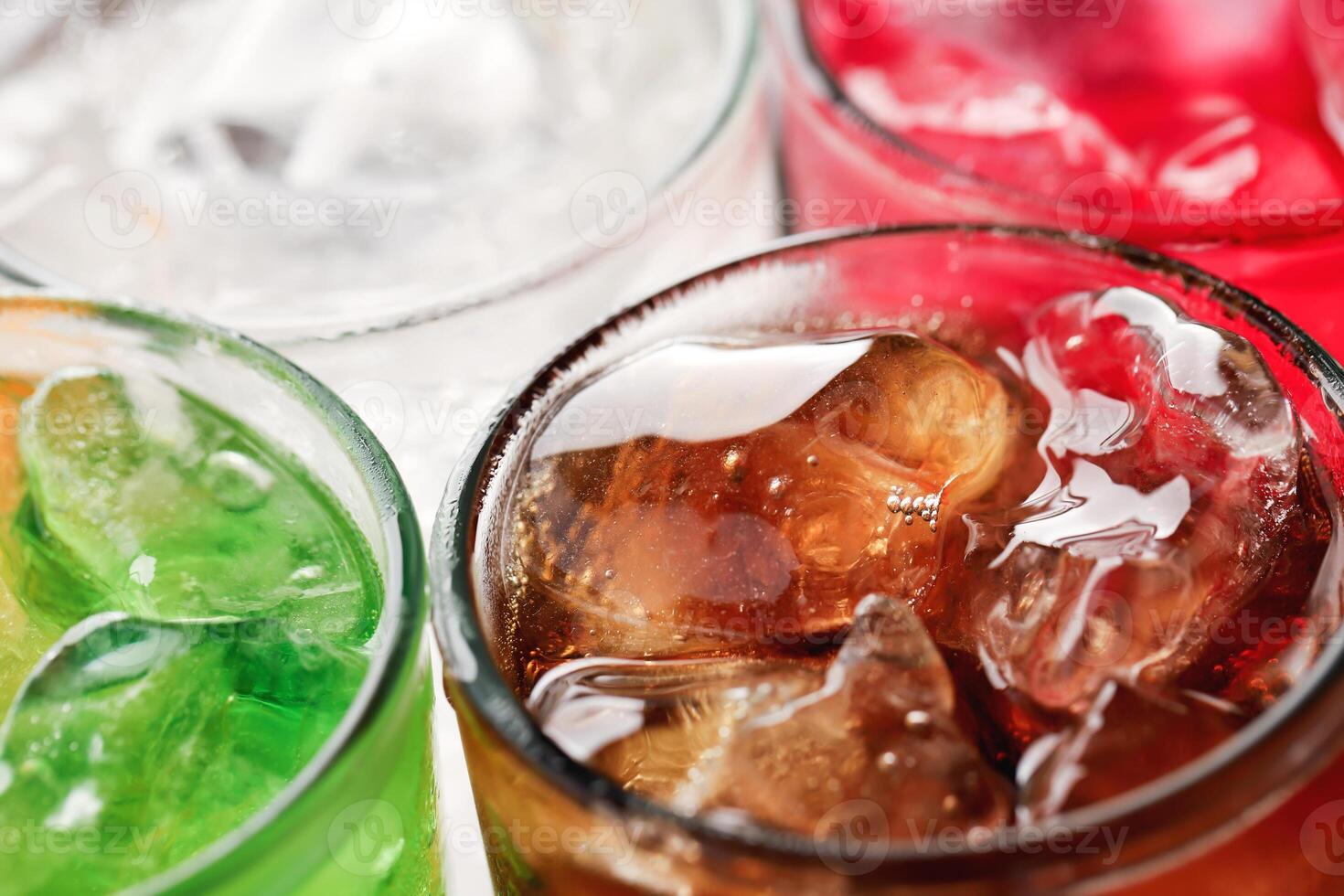 Soft drinks and fruit juice mixed with soda high in sugar have a negative effect on physical health photo