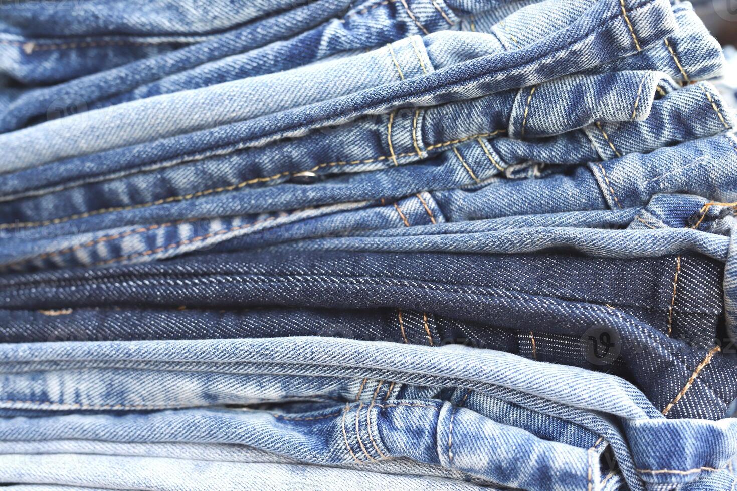 beautiful fashion jeans Stacked in layers at the jeans store photo