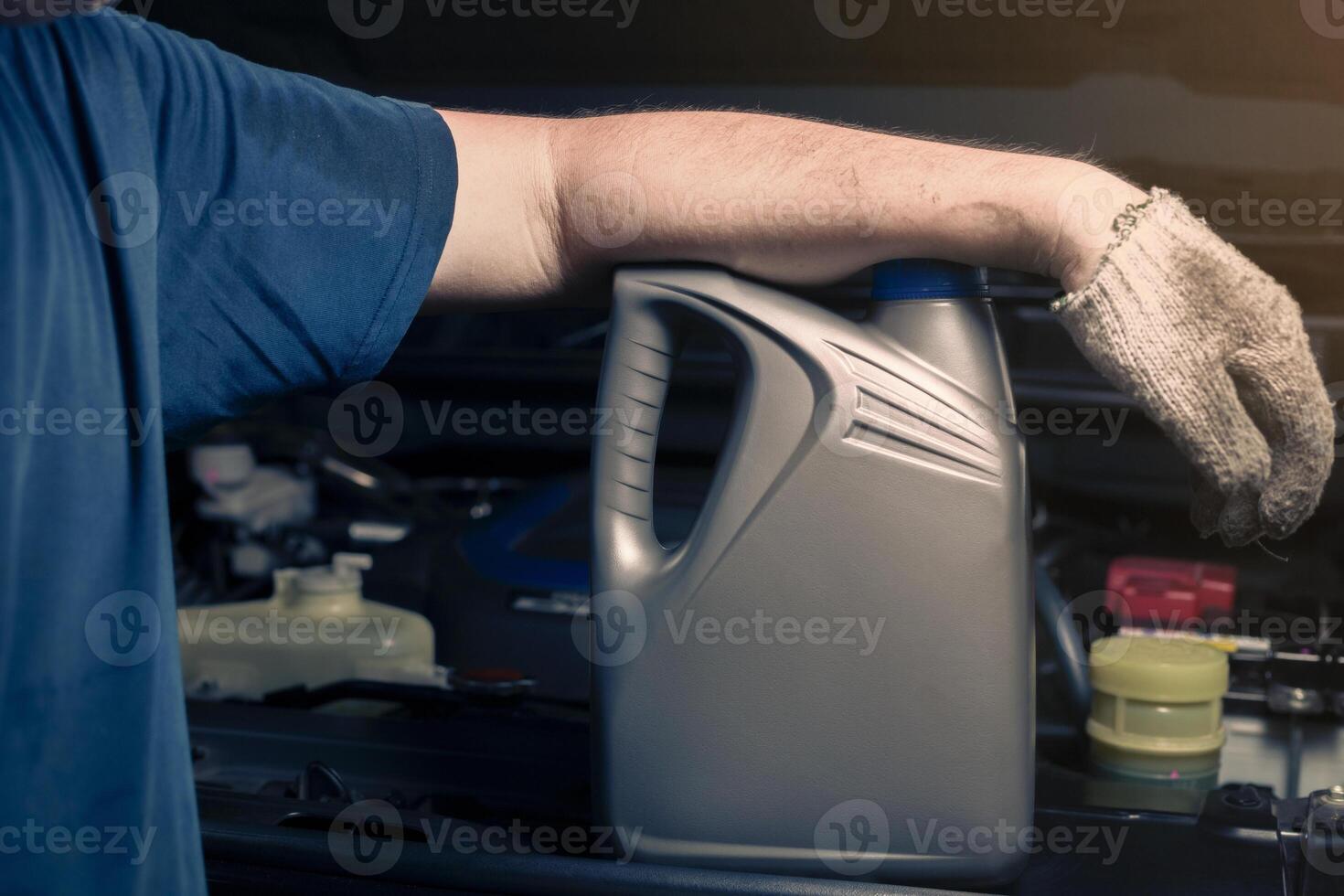 lubricant bottle On the background of engine lubricant, oil change shop, engine service industry. photo