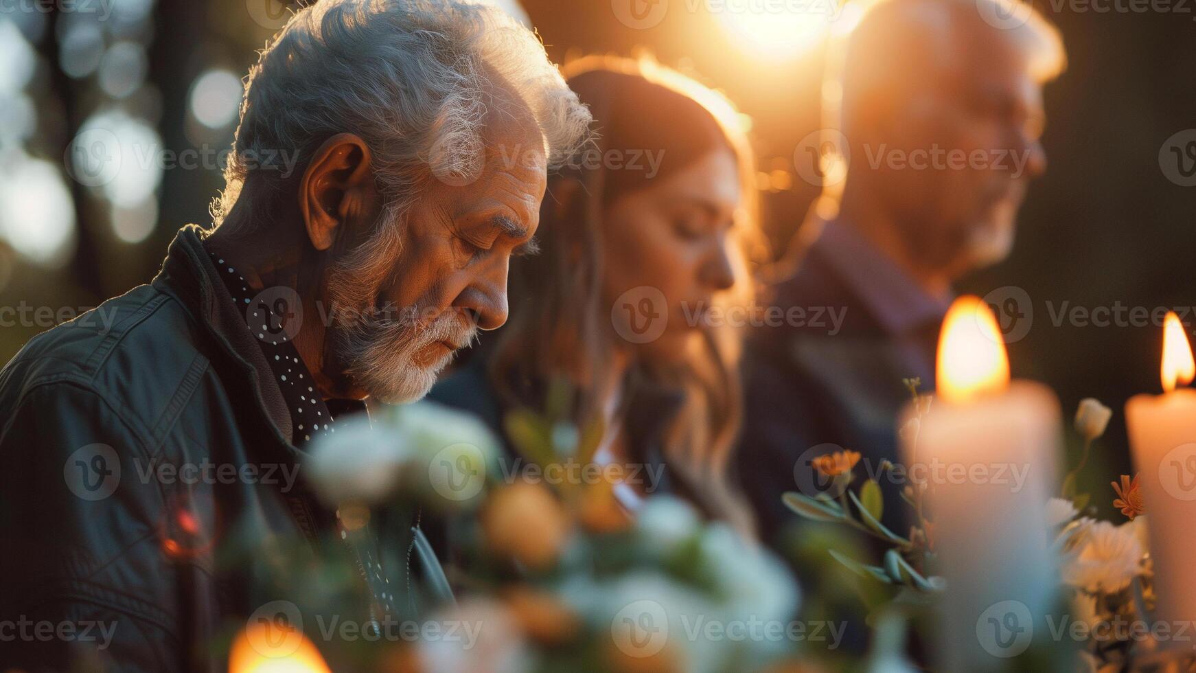 Capture the solemnity of a memorial service, with friends and family paying their respects to a loved one photo