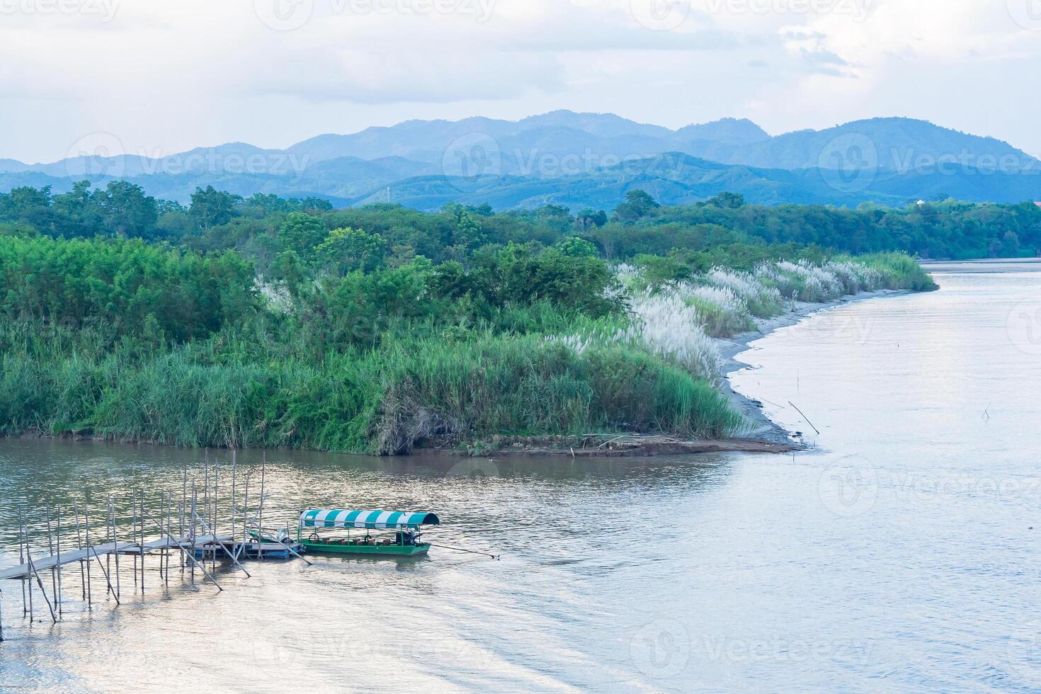 Landscape beautiful of the Mekong river with mountains and sky background at Golden Triangle, Chiang Sean, Chiang Rai, Thailand. Holiday and Travel concept photo