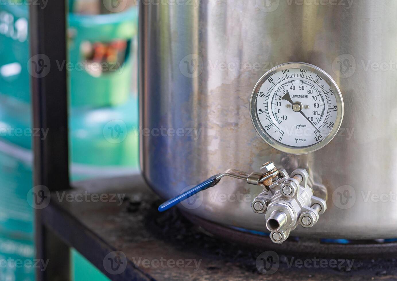 Close-up of alcohol thermometer on craft beer tank. Selective focus. Home brewing process. photo