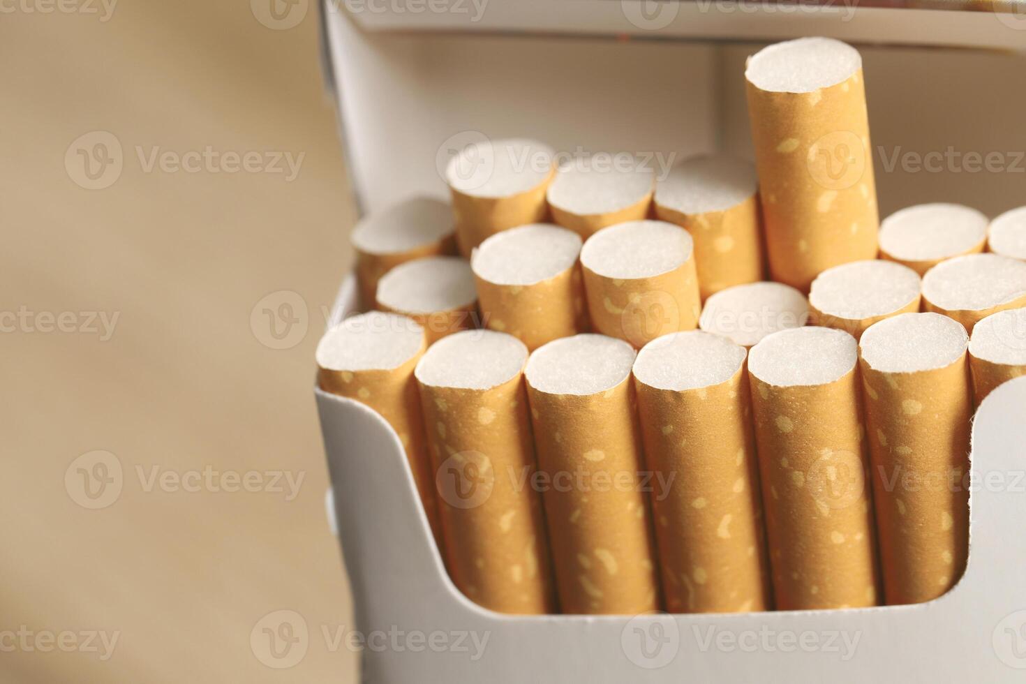 peel it off Cigarette pack prepare smoking on white wooden background. Packing line up. photo filters Natural light