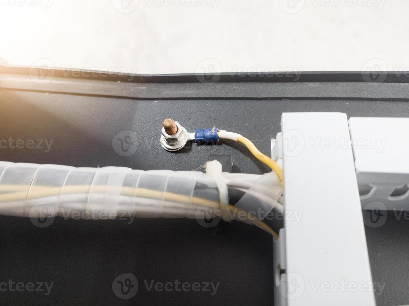 Cables grounding of the Earthing point system on electrical panel board. photo