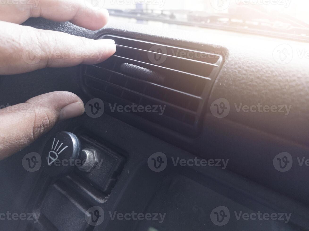 The cooling ventilation system in the car. the driver checking the air conditioner in the car. photo