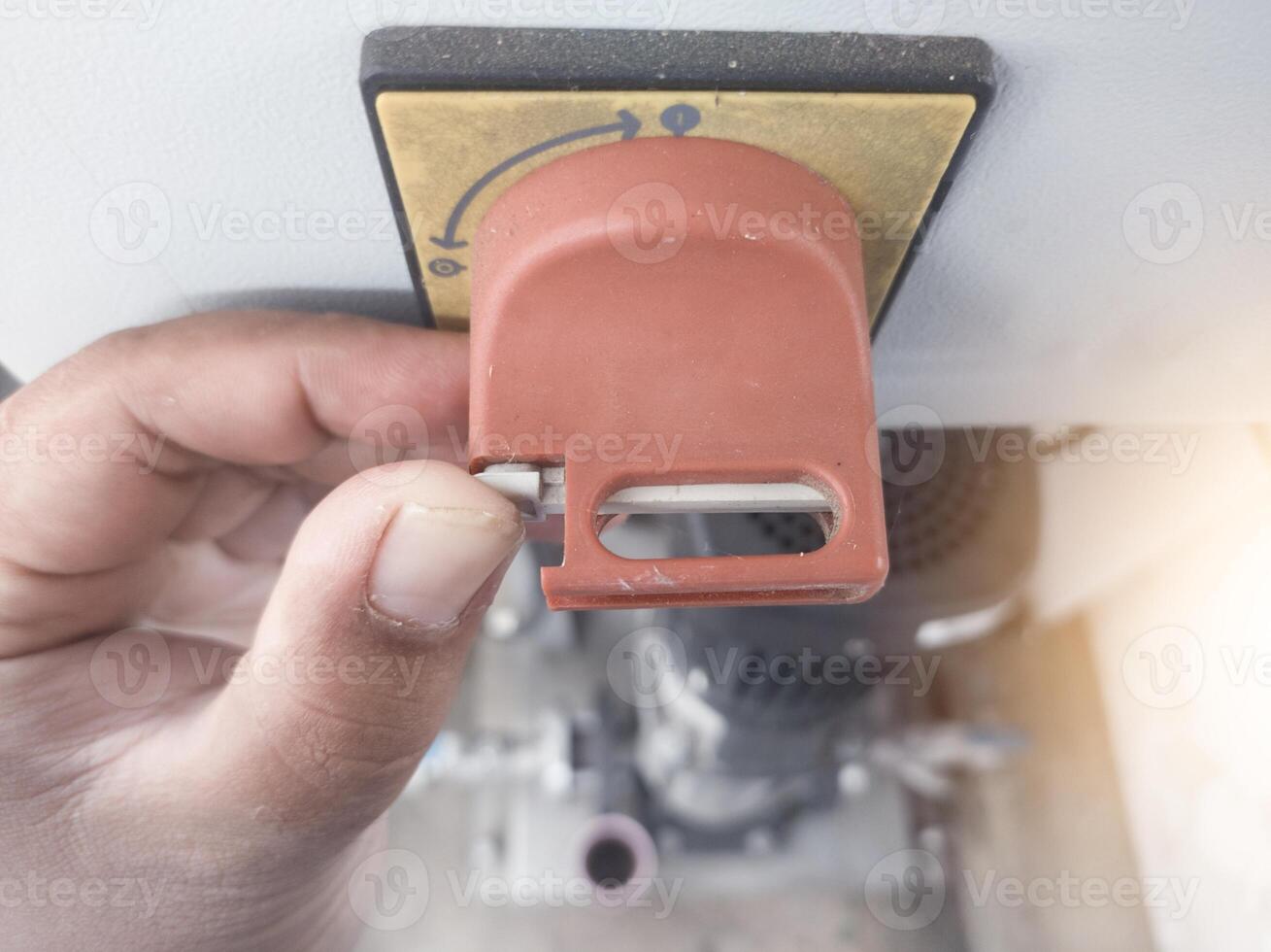 Close up the Main power disconnect switch panel control with the hole for padlock protection service warning. photo