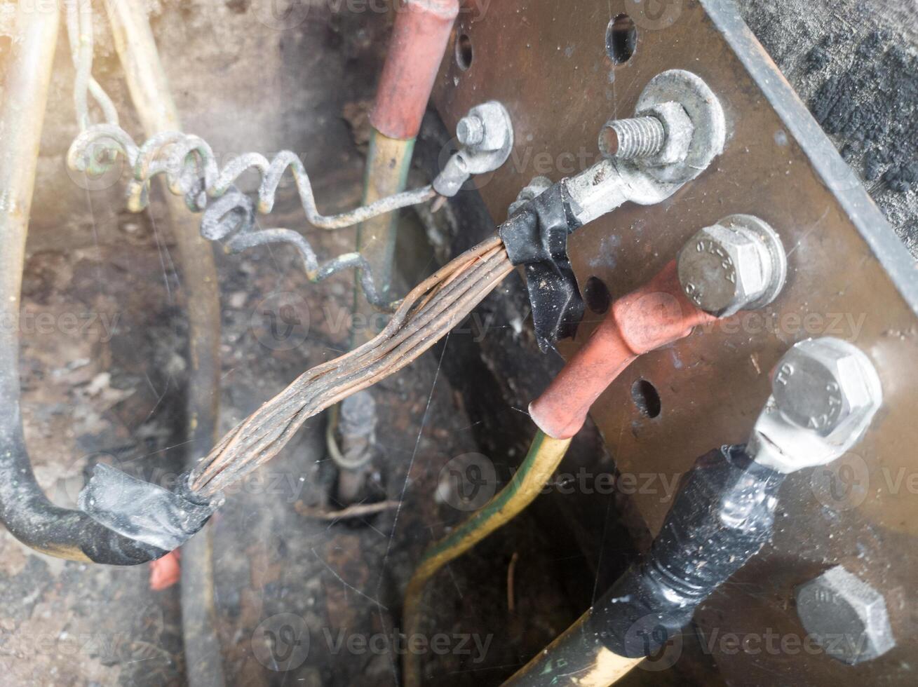 Burnt ground cable, failure in the industrial electrical installation grounding system. Failure earth system concept. photo