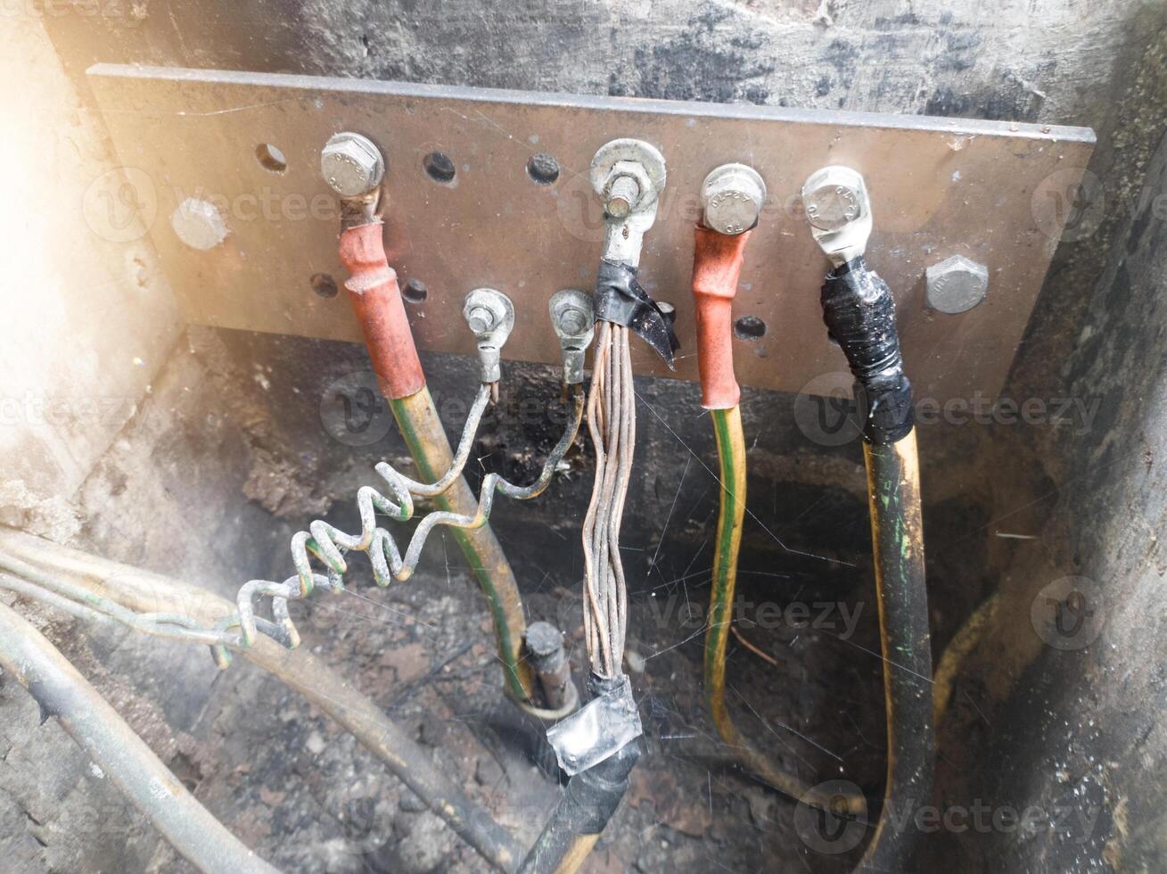 Burnt ground cable, failure in the industrial electrical installation grounding system. Failure earth system concept. photo