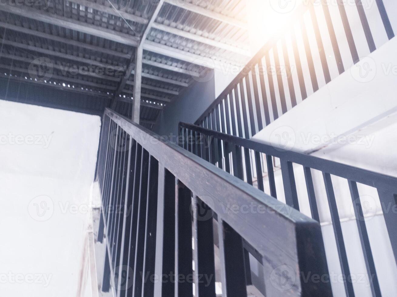 Interior of the stairs leading to the top floor in an industrial office building. photo