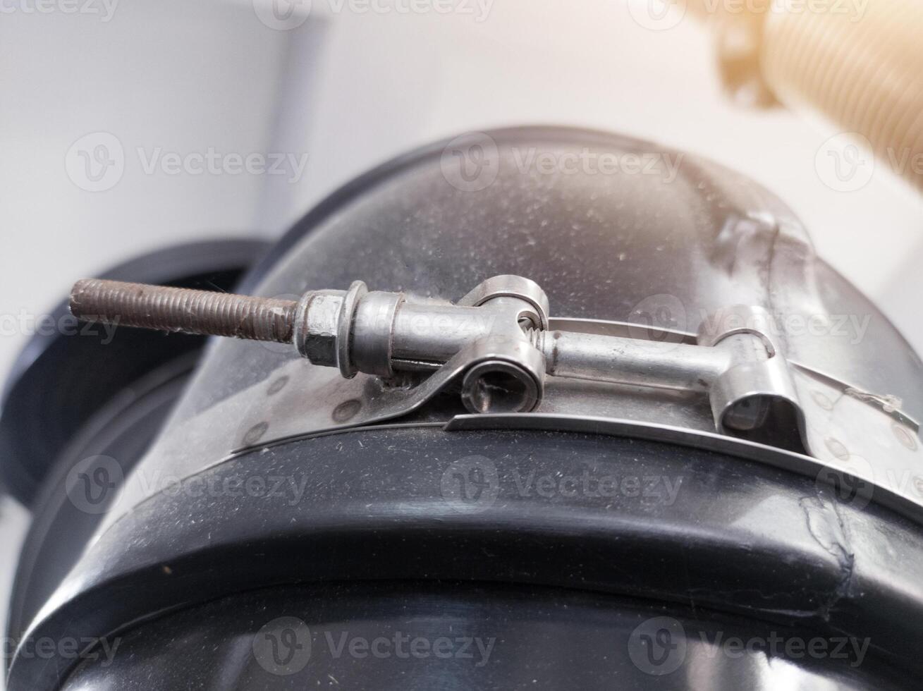Use of Stainless steel T bolt clamps in rubber hose pipe connections. photo
