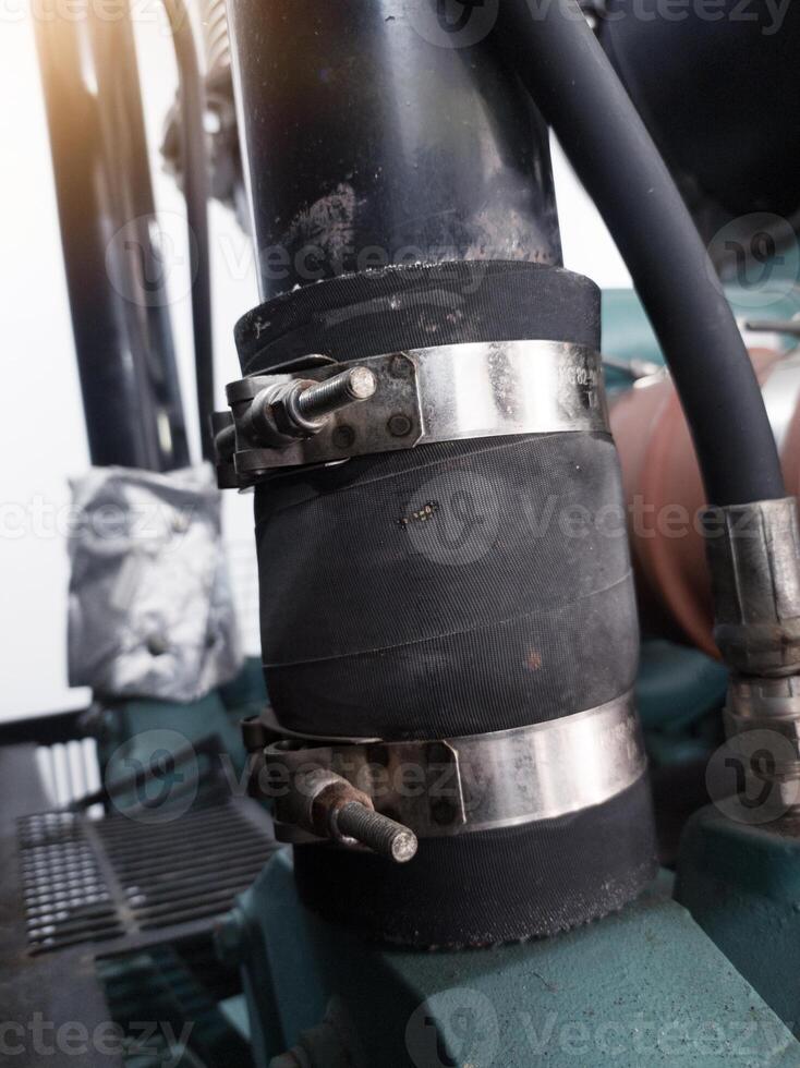 Use of Stainless steel T bolt clamps in rubber hose pipe connections. photo