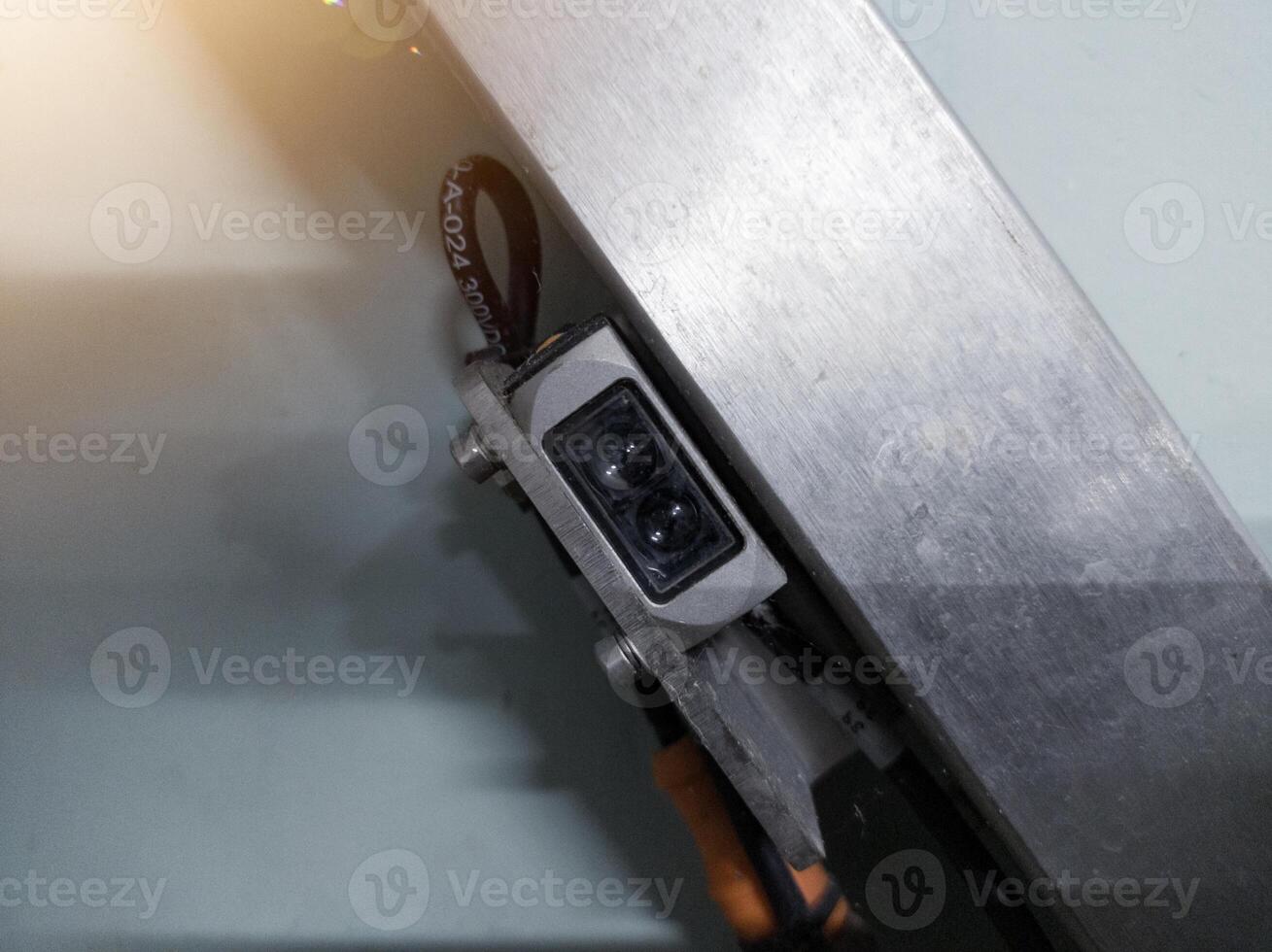 Installation of infrared sensor on the machine control. photo