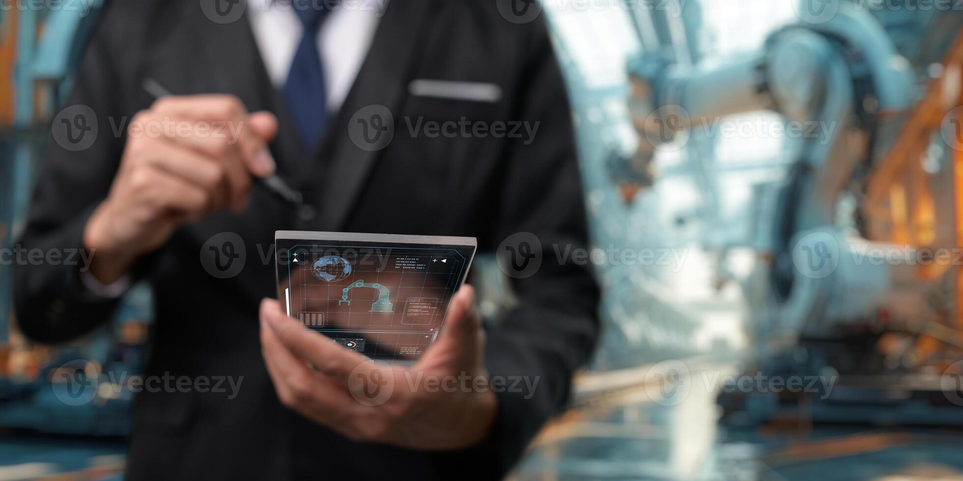 Control the work with an infographic screen. Precision engineering A robotic arm at work in a fully automated facility. Control the work of the robotic arm with an infographic screen. photo
