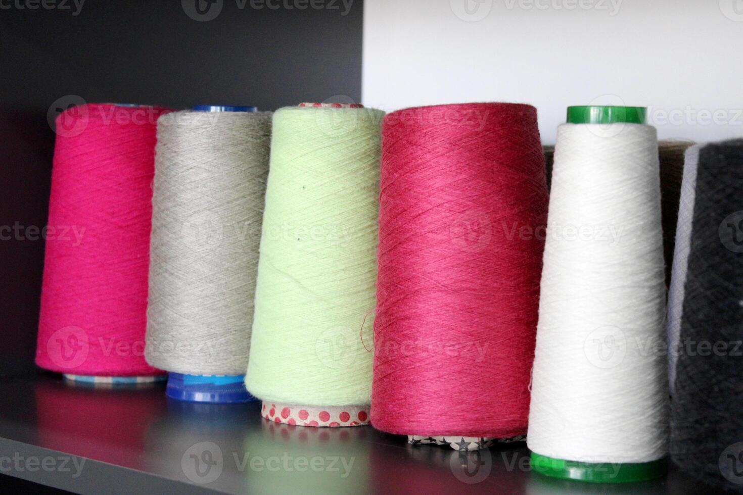 Colorful sewing threads wound on a thread spool. textile photo